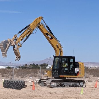 Dig This - Picking up and stacking tires. - Amusement Parks Near Me - Las Vegas, Nevada