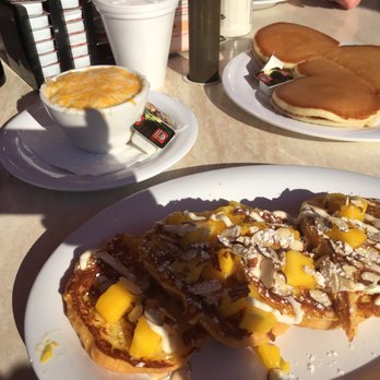 Citrus - Mango Almond croissant French toast with cheese grits and buttermilk Mickey Mouse pancakes - American Near Me - Virginia Beach, Virginia