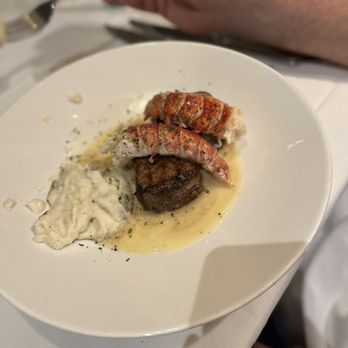 The Capital Grille - Seared tenderloin with butter poached lobster tails - Steakhouses Near Me - Baltimore, Maryland The Capital Grille - Seared tenderloin with butter poached lobster tails - Steakhouses Near Me - Baltimore, Maryland