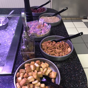 Chuck E. Cheese - a variety of food items on a counter - Pizza Near Me - Fresno, California