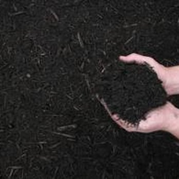 Mulch & More - a person holding a handful of mulch - Landscaping Near Me - Malvern, Pennsylvania Mulch & More - a person holding a handful of mulch - Landscaping Near Me - Malvern, Pennsylvania