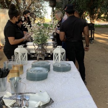 El Gaucho Catering AZ - Outdoor wedding in March (during Covid). Guests being served at the buffet. - Caterers Near Me El Gaucho Catering AZ - Outdoor wedding in March (during Covid). Guests being served at the buffet. - Caterers Near Me