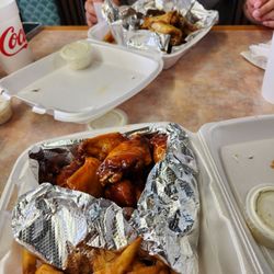 Hipnotic Wings - Sweet heat peach wings in the front; white buffalo dry wings in the back.