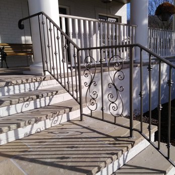 Modern Iron Concepts - Classic scrolled panels work well with collared balusters on this beautiful rocking porch. - Fences & Gates Near Me - Nashville, Tennessee Modern Iron Concepts - Classic scrolled panels work well with collared balusters on this beautiful rocking porch. - Fences & Gates Near Me - Nashville, Tennessee