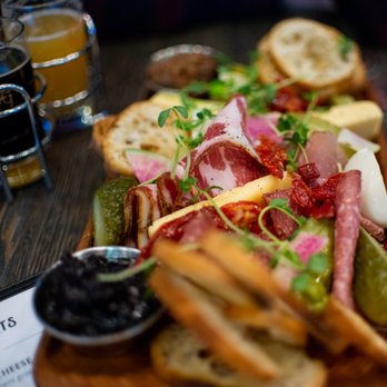 Copper Brewing - a platter of sandwiches with pickles and pickles - Breweries Near Me - Kelowna, British Columbia Copper Brewing - a platter of sandwiches with pickles and pickles - Breweries Near Me - Kelowna, British Columbia
