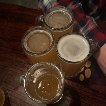 Pub Dog - four beer glasses on a table - Pizza Near Me - Baltimore, Maryland