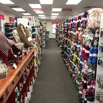 The Loopy Ewe - Most of our yarn hangs on pegs so you can see the whole skein at a glance. - Knitting Supplies Near Me - Loveland, Colorado The Loopy Ewe - Most of our yarn hangs on pegs so you can see the whole skein at a glance. - Knitting Supplies Near Me - Loveland, Colorado