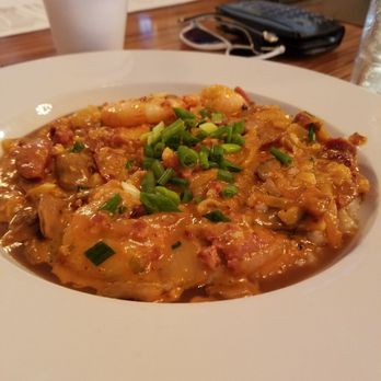 Cast Iron Kitchen - Shrimp and grits! So good. This was the half portion (more than enough!) - Southern Near Me - Wilmington, North Carolina Cast Iron Kitchen - Shrimp and grits! So good. This was the half portion (more than enough!) - Southern Near Me - Wilmington, North Carolina