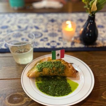 Mexican Mom - a plate of food and a glass of wine - Mexican Near Me - Spring, Texas