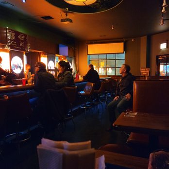 Ludlow Liquors - people sitting at a bar - Cocktail Bars Near Me - Chicago, Illinois