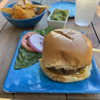Pier Teaki - Black bean burger with chips & guacamole - Tiki Bars Near Me - St. Petersburg, Florida Pier Teaki - Black bean burger with chips & guacamole - Tiki Bars Near Me - St. Petersburg, Florida