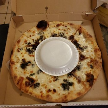 Enjay's Pizza - I put the regular sized styrofoam plate on the pizza as a reference. - Pizza Near Me - Philadelphia, Pennsylvania