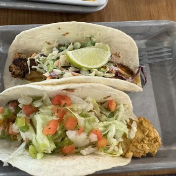 Tacos 4 Life - Collierville - Close up of the blackened mahi-mahi taco and the Baja fish (fried) taco. - Tacos Near Me - Collierville, Tennessee Tacos 4 Life - Collierville - Close up of the blackened mahi-mahi taco and the Baja fish (fried) taco. - Tacos Near Me - Collierville, Tennessee