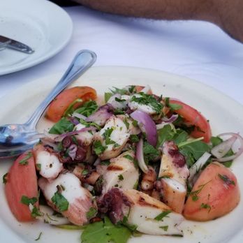 Liman Restaurant - Delicious grilled octopus on top of arugula, tomatoes and red onions. This is a must order! - Turkish Near Me - Brooklyn, New York