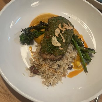 Delicia - Coconut curried dish- mahi with broccolini, plantain rice garlic shavings - Latin American Near Me - Indianapolis, Indiana