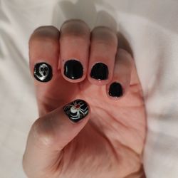 Beauty Nail - Pedicure, left hand, black polish with a spider and ghost.