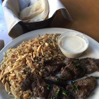 Aladdin's Eatery - Mediterranean lamb plate with tahini yogurt sauce. Lamb well seasoned but overcooked, so it is tough. Rating: Acceptable. - Mediterranean Near Me - Raleigh, North Carolina Aladdin's Eatery - Mediterranean lamb plate with tahini yogurt sauce. Lamb well seasoned but overcooked, so it is tough. Rating: Acceptable. - Mediterranean Near Me - Raleigh, North Carolina