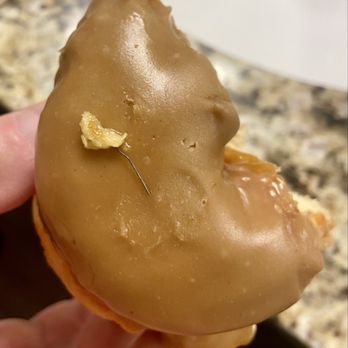 Voodoo Doughnut - A piece of wire found INSIDE Voodoo Donuts' maple donut (luckily found before the bite was swallowed but YIKES) - Donuts Near Me - Denver, Colorado