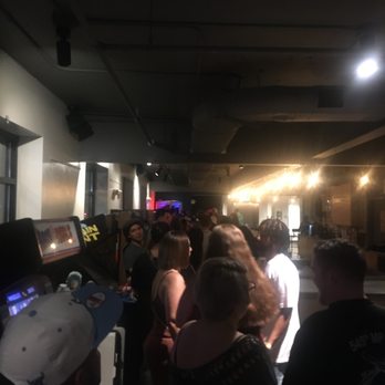 Williwaw - a large group of people standing in a room - New American Near Me - Anchorage, Alaska