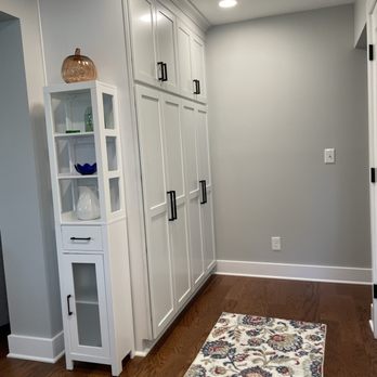 Bongero Construction & Remodeling - a kitchen with white cabinets and wood floors - General Contractors Near Me - Livonia, Michigan Bongero Construction & Remodeling - a kitchen with white cabinets and wood floors - General Contractors Near Me - Livonia, Michigan