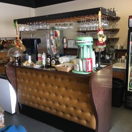 a woman sitting at a bar a woman sitting at a bar