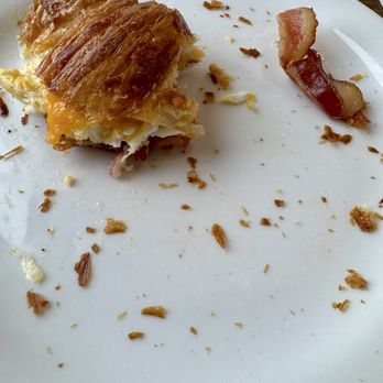 Alani Bakery - This is what's left of my Farmhand breakfast croissant. Egg, cheddar, bacon. - Bakeries Near Me - Coeur d'Alene, Idaho Alani Bakery - This is what's left of my Farmhand breakfast croissant. Egg, cheddar, bacon. - Bakeries Near Me - Coeur d'Alene, Idaho