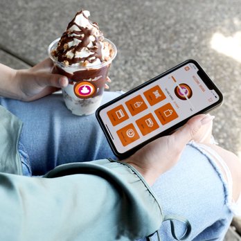 Yogurt Mill - a person holding a cell phone - Ice Cream & Frozen Yogurt Near Me - Modesto, California