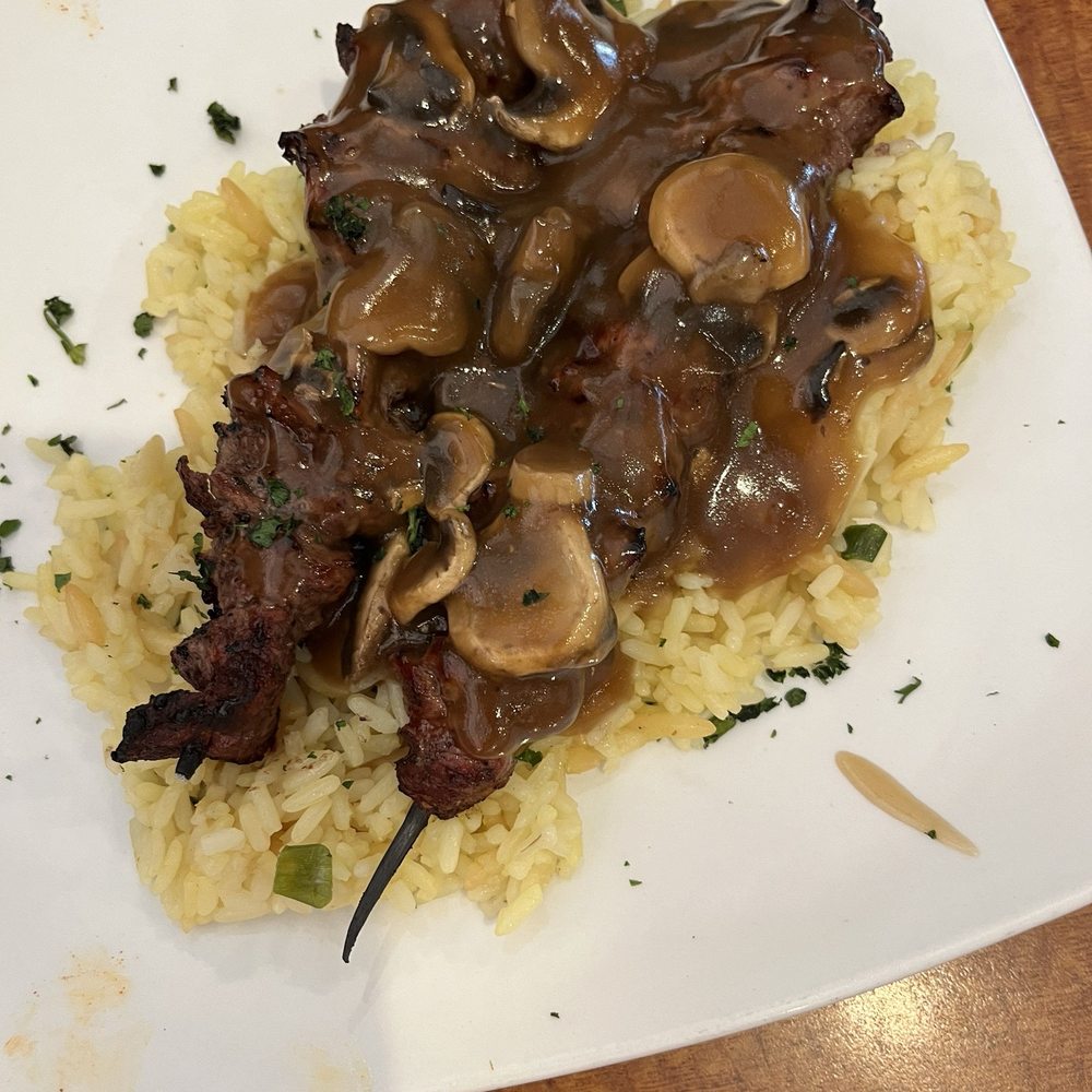 Sizzler - Sirloin steak kebabs on a bed of yellow rice - Seafood Near Me - Los Angeles, California Sizzler - Sirloin steak kebabs on a bed of yellow rice - Seafood Near Me - Los Angeles, California