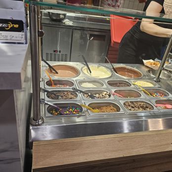 Pizza One - Zeppole toppings bar. She fills the zeppoles with fresh caramel from those pumps when they come out of oven. - Pizza Near Me - Scarsdale, New York