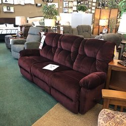 Greg's Sleep Center - Motion Sofa in a beautiful Burgundy fabric.