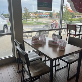 Krispy Kreme - Tables with hats - Donuts Near Me - Saint Peters, Missouri