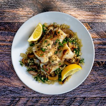 Flying Star Café - Fish Dish - Seasoned, pan fried Wild Alaskan Cod, with porcini butter, over sautéed fresh spinach, mushrooms, & Israeli couscous. - Breakfast & Brunch Near Me - Albuquerque, New Mexico Flying Star Café - Fish Dish - Seasoned, pan fried Wild Alaskan Cod, with porcini butter, over sautéed fresh spinach, mushrooms, & Israeli couscous. - Breakfast & Brunch Near Me - Albuquerque, New Mexico