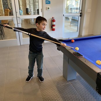 Enclave Falcon Pointe Apartments - Clubhouse with Pool tables and tvs - Apartments Near Me - Pflugerville, Texas Enclave Falcon Pointe Apartments - Clubhouse with Pool tables and tvs - Apartments Near Me - Pflugerville, Texas