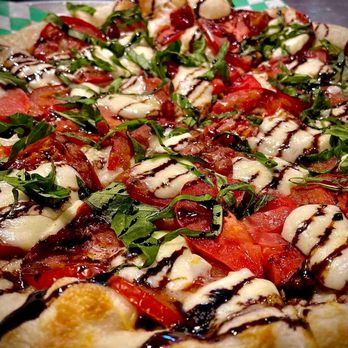 The Green Lantern Tavern - a pizza with tomatoes and mozzarella - Pubs Near Me - Walla Walla, Washington The Green Lantern Tavern - a pizza with tomatoes and mozzarella - Pubs Near Me - Walla Walla, Washington