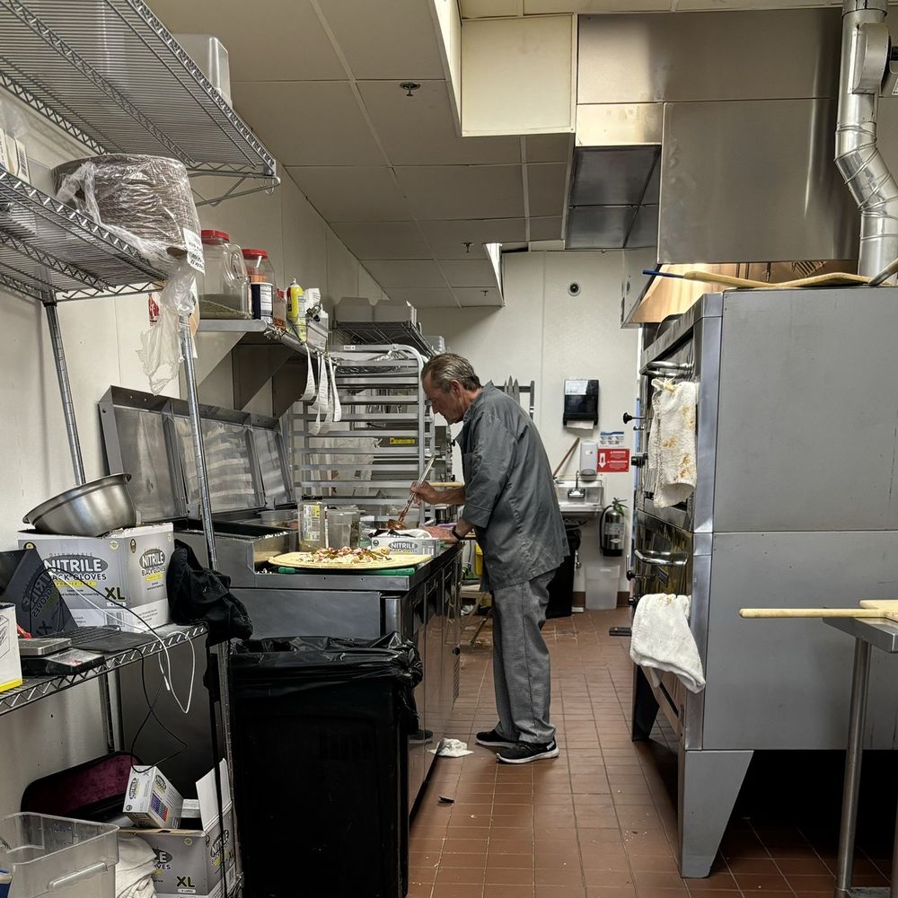 Dough Daddy's Pizza - a man in a commercial kitchen - Pizza Near Me - Westmont, Illinois