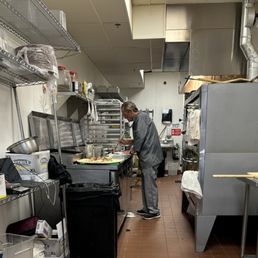 a man in a commercial kitchen a man in a commercial kitchen