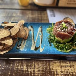 Salt Shack - Tuna tartare: avocado, seaweed salad, sesame and ginger soy drizzle and wasabi aioli. Topped with sesame seeds and green onion.