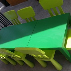 Child-sized tables and chairs for snack, lunch, arts and crafts, and reading.