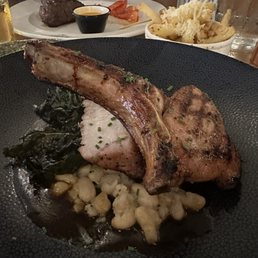 Pork chop special, filet and truffle fries. Pork chop special, filet and truffle fries.
