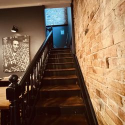 One 2 One Cafe - Photo of founder. Beautiful stairs and wall.