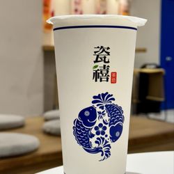 Teazzi Tea Shop - Dark Roast Black Milk Tea (70% Sugar and 30% ice) added oats for texture. 70% sweetness was a tad bit too sweet for my liking.