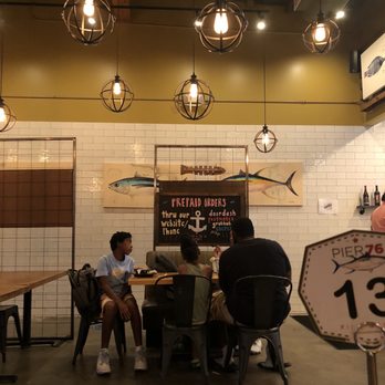 Pier 76 Fish Grill - two people sitting at a table - Seafood Near Me - Riverside, California