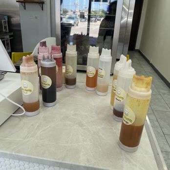 Mr Puffy Japanese Cheesecake - Each of these syrups are 1.50 each and they're just laying out. - Desserts Near Me - Dallas, Texas