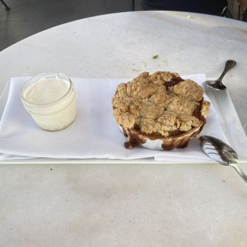 Jane At The Marketplace - Peach cobbler with vanilla ice cream. 10 out of 10 - New American Near Me - Goleta, California