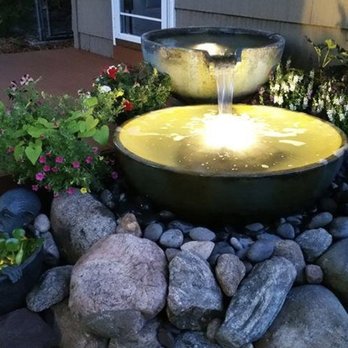 Tai no Water Features - a water fountain surrounded by rocks - Landscaping Near Me