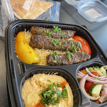 Cafe Yafa - Kofta plate, ground beef kebab on a bed of rice with a side of humus, salad and pita bread. Excellent! - Mediterranean Near Me - Natick, Massachusetts