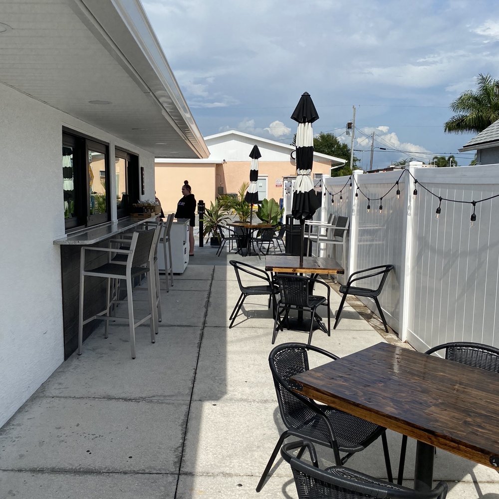 Postal 98 Cafe - Left seating area - Coffee & Tea Near Me - Sarasota, Florida Postal 98 Cafe - Left seating area - Coffee & Tea Near Me - Sarasota, Florida