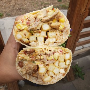 Mo Burrito - a hand holding a burrito - Bars Near Me - Salida, Colorado Mo Burrito - a hand holding a burrito - Bars Near Me - Salida, Colorado