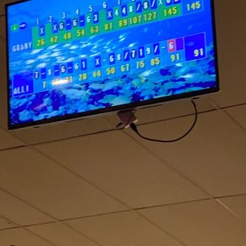 Sparetime Lanes - a large television screen in the middle of a room - American Near Me - Roy, Utah
