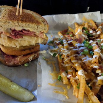 Bull McCabe's Irish Pub - Mile high Reuben and loaded fries by request. - Irish Near Me - Durham, North Carolina